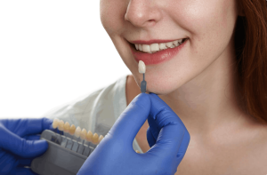 woman trying on different tooth crowns