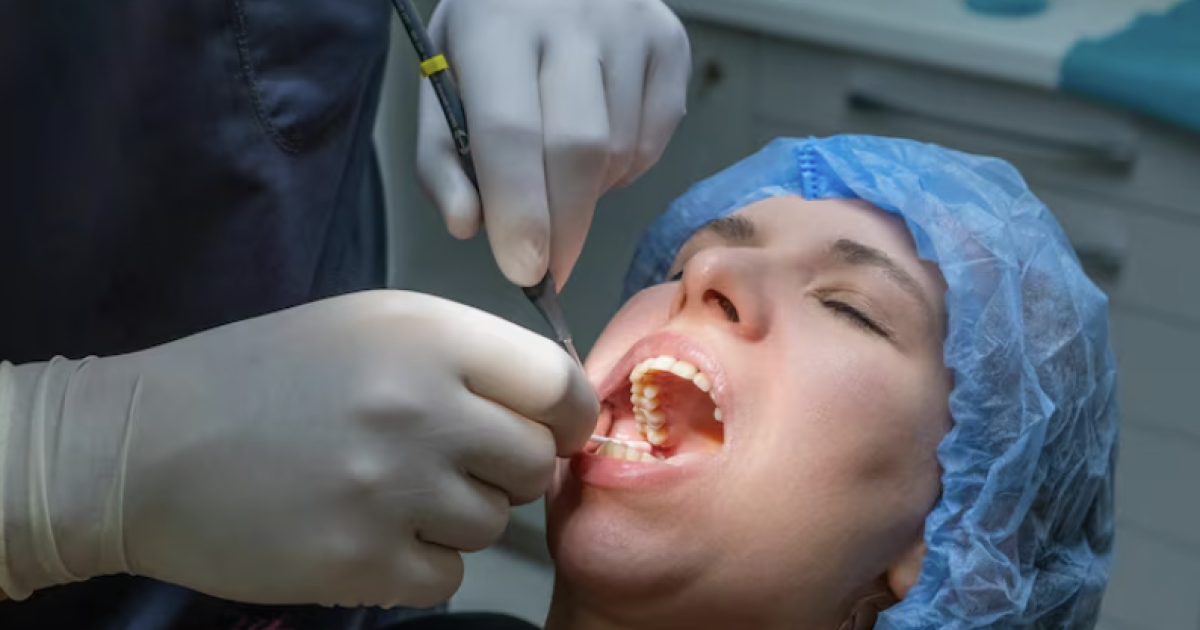 patient getting her teeth checked