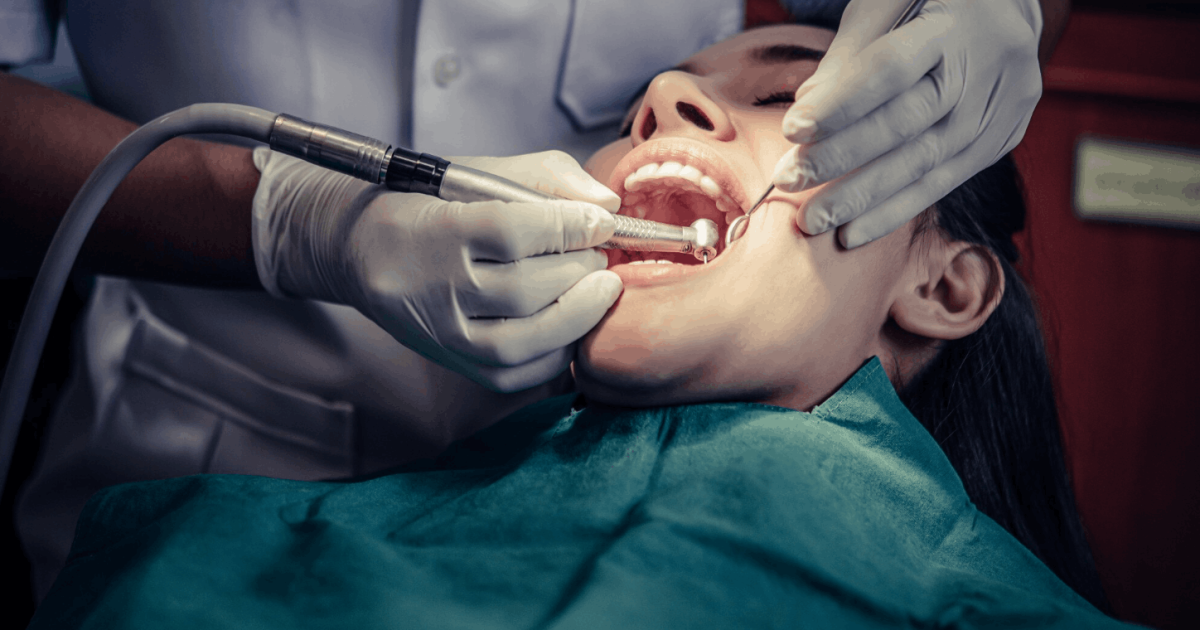 patient going through tooth scaling procedure